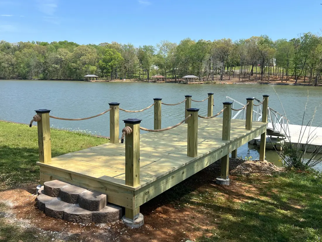 Rebuilt lakefront dock with new decking and post caps
