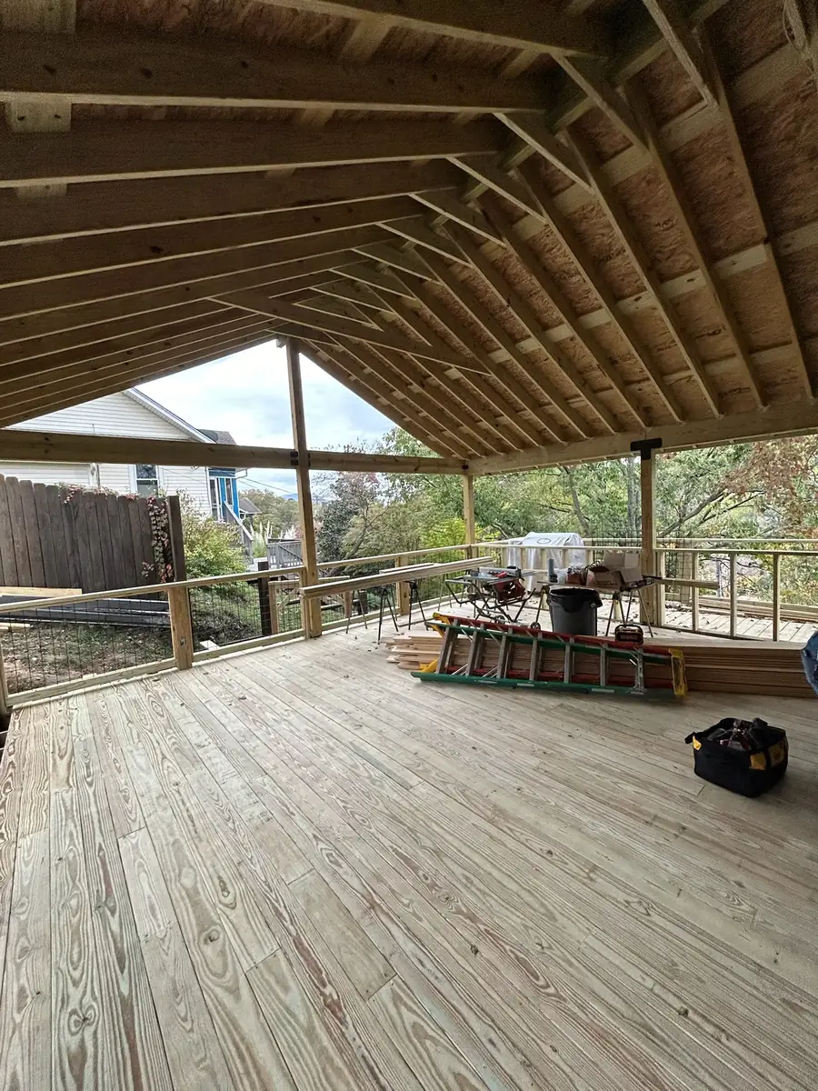 Gable roof framing seen from inside the covered porch