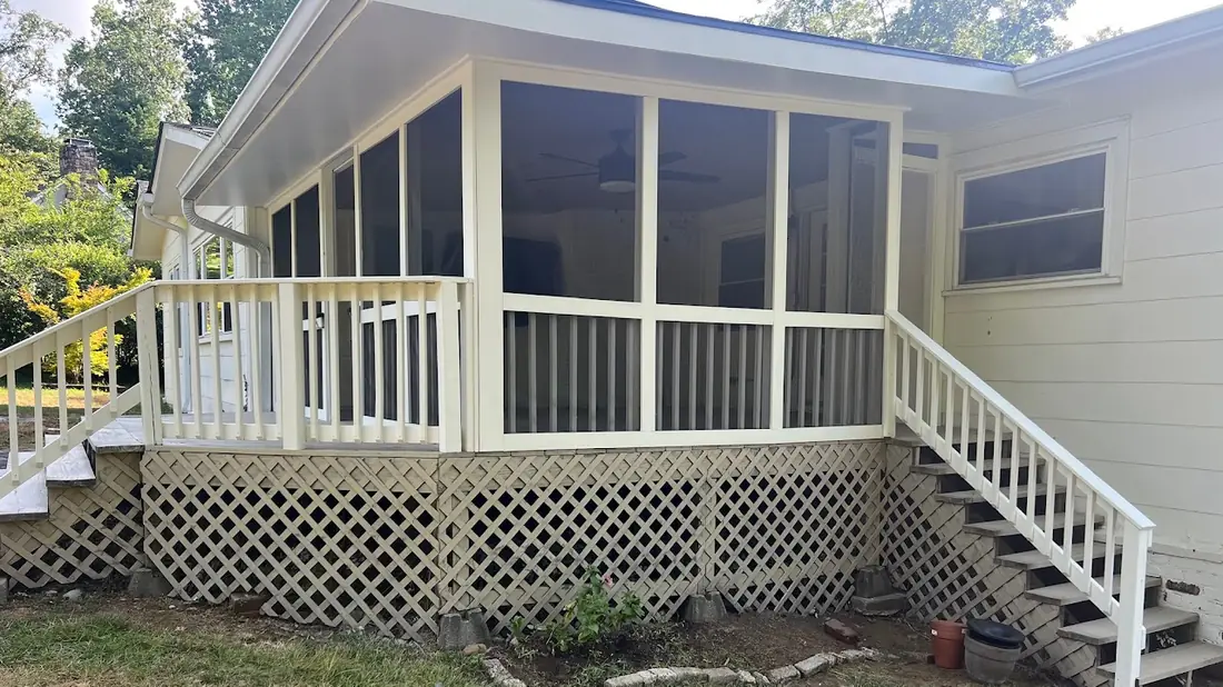 Screened porch addition with white trim