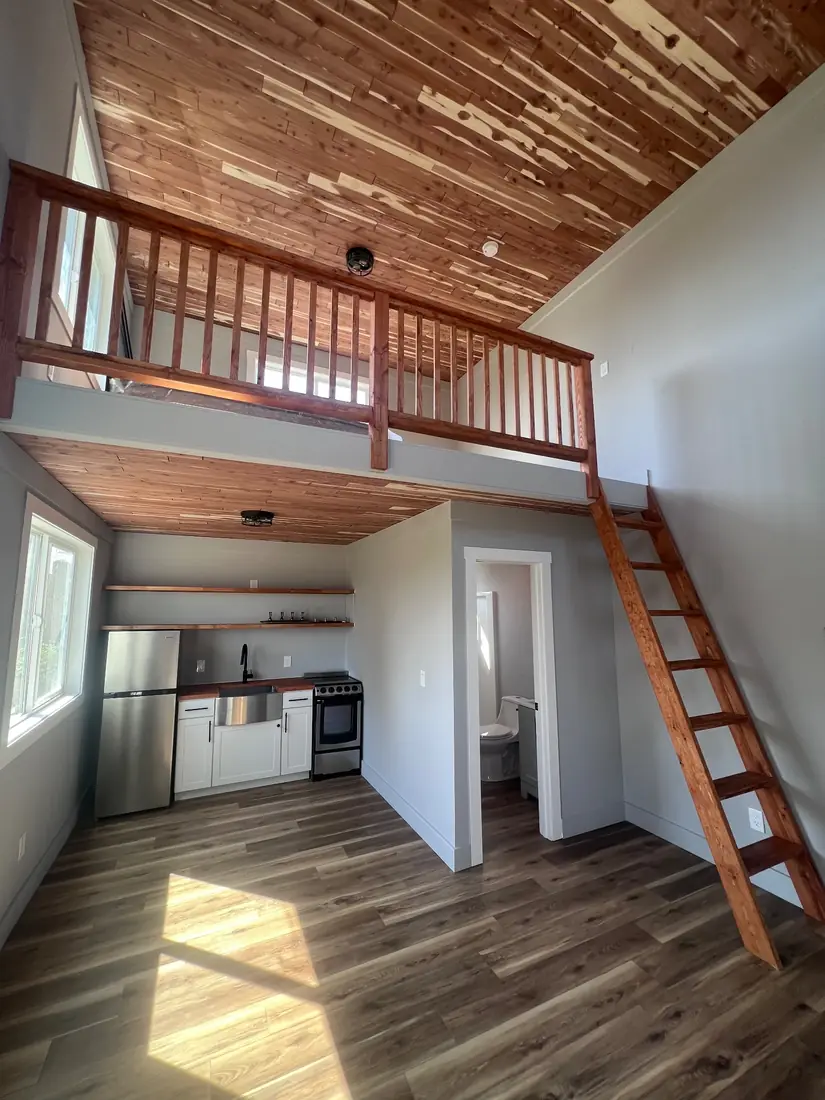 ADU interior with sleeping loft and kitchenette